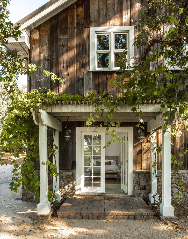 Entryway - cottage entryway idea in San Francisco with a glass front door