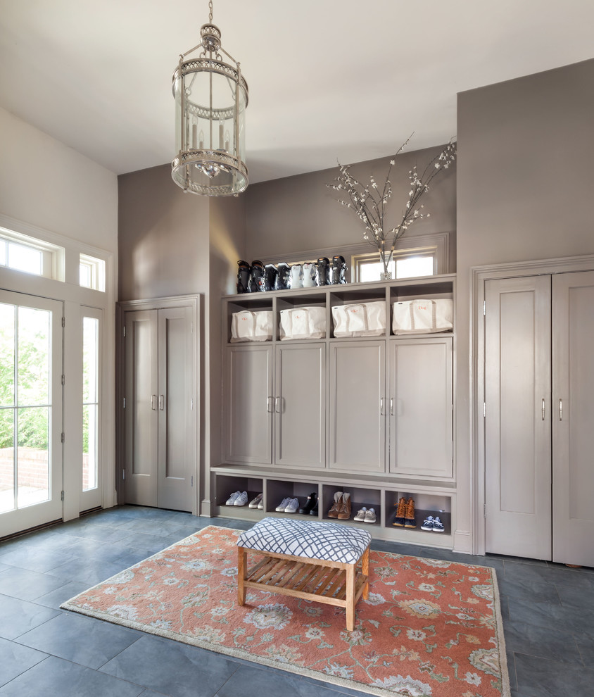 Classic boot room in New York with grey walls and grey floors.