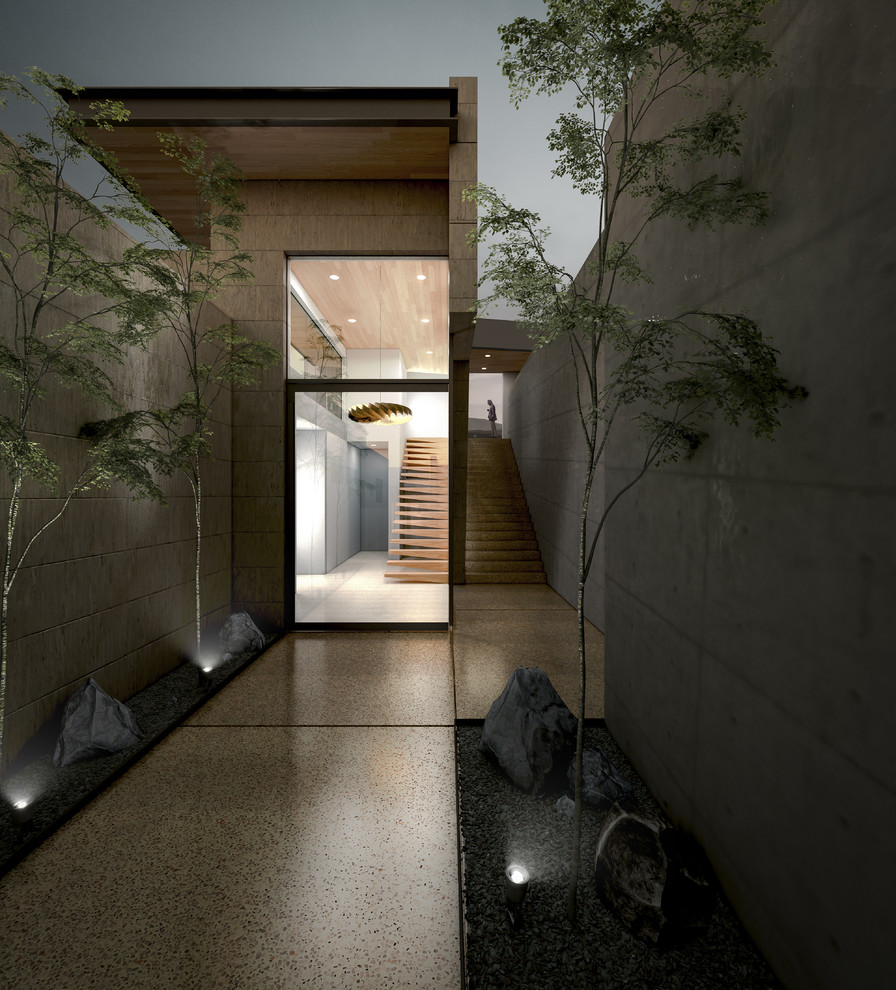 Inspiration for a large modern concrete floor front door remodel in Los Angeles with a glass front door