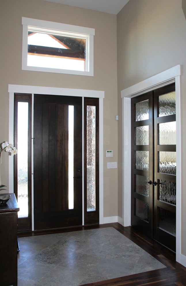 Design ideas for a classic foyer in Denver with a single front door and a dark wood front door.