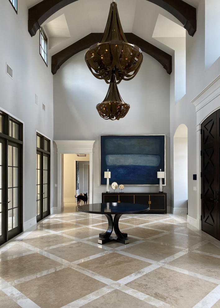 Inspiration for a large traditional foyer in Orlando with grey walls, travertine flooring, a double front door, a dark wood front door and beige floors.