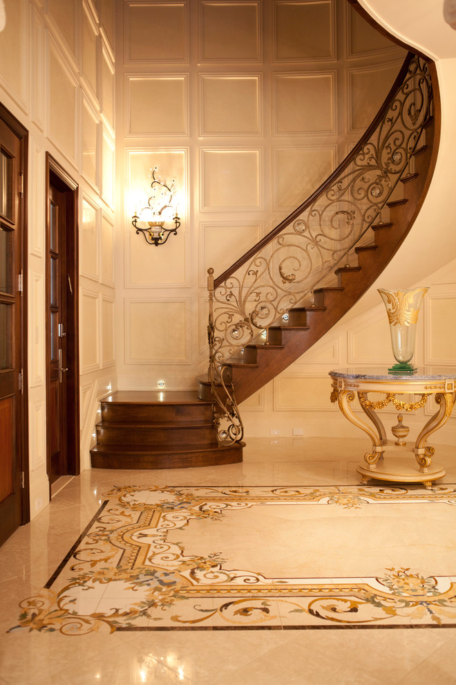 Expansive traditional foyer in New York with beige walls.