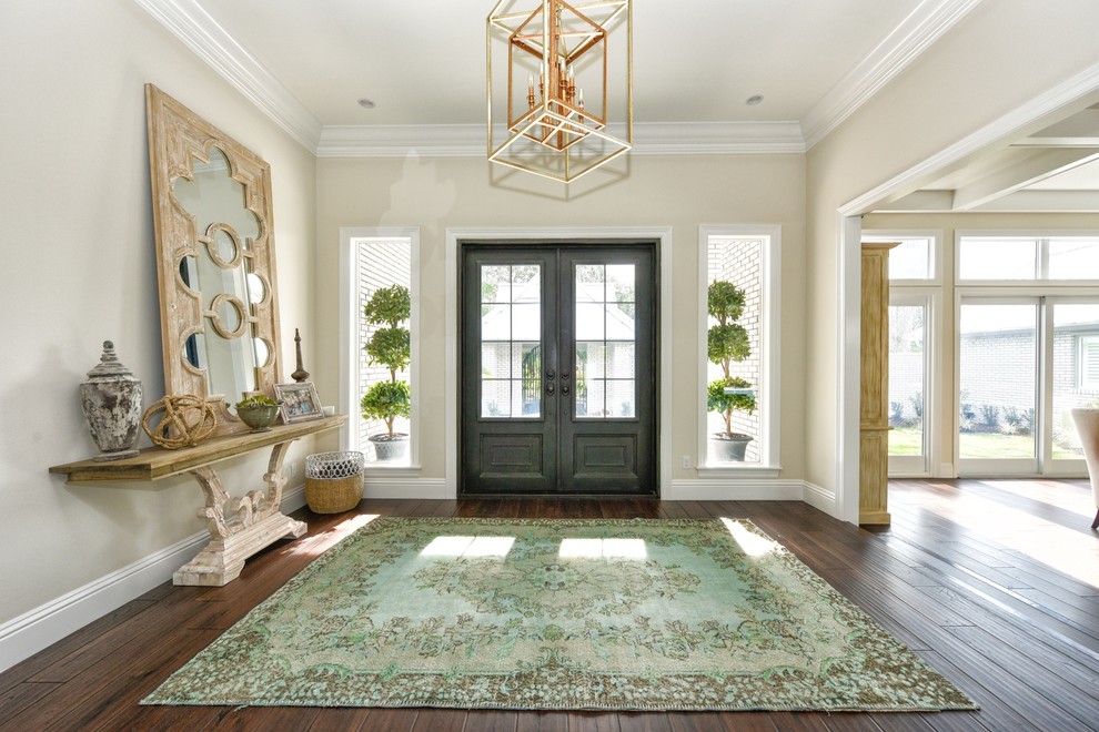 Inspiration for a large transitional dark wood floor and brown floor entryway remodel in Tampa with beige walls and a gray front door