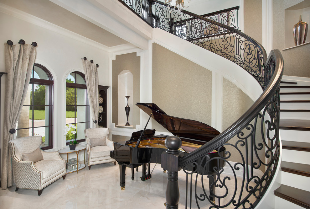Design ideas for an expansive mediterranean foyer in Miami with beige walls, marble flooring and white floors.