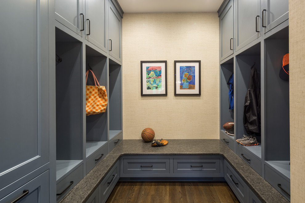This is an example of a traditional boot room in Cincinnati with beige walls, dark hardwood flooring and brown floors.