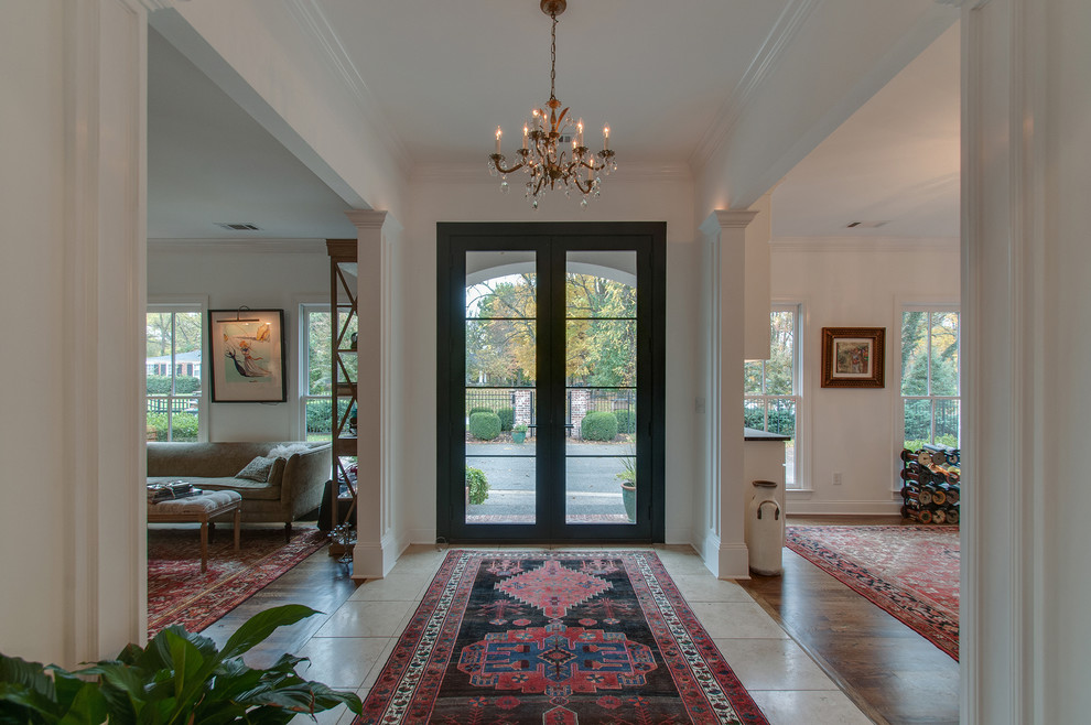 Medium sized romantic foyer in Nashville with white walls, marble flooring, a double front door, a black front door, beige floors and feature lighting.