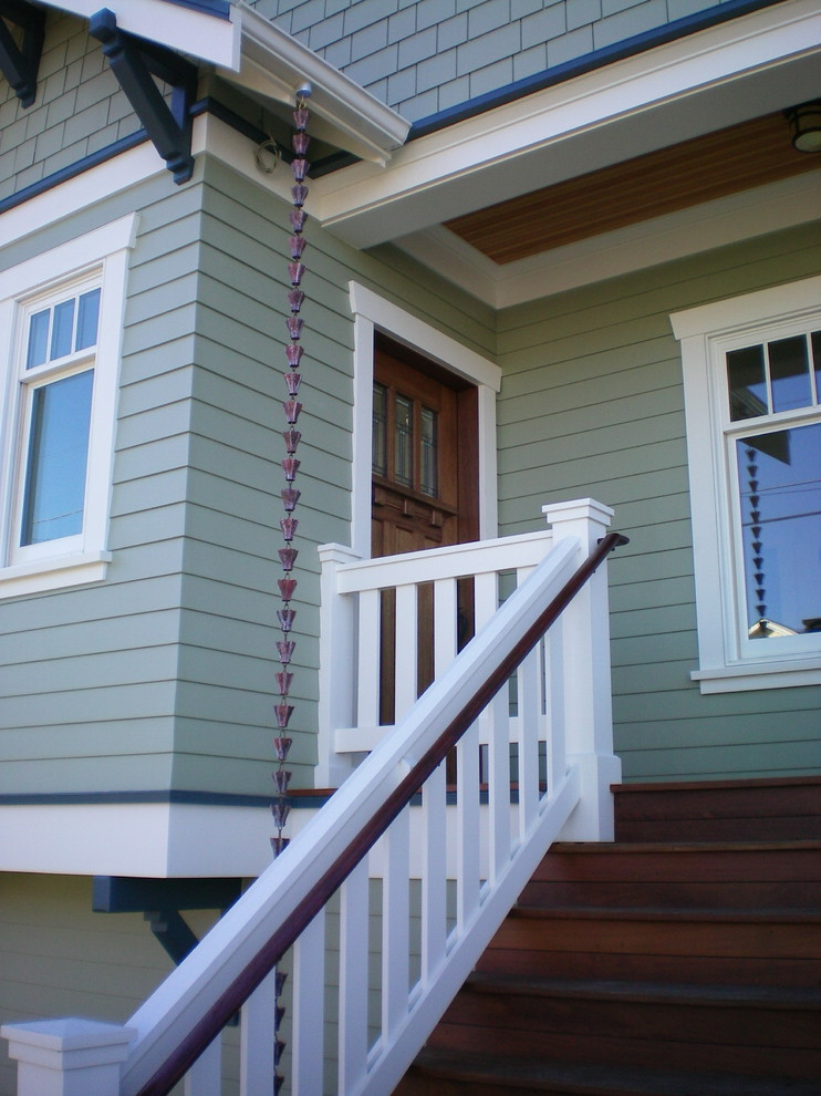 Traditional porch in Seattle with a single front door and a dark wood front door.