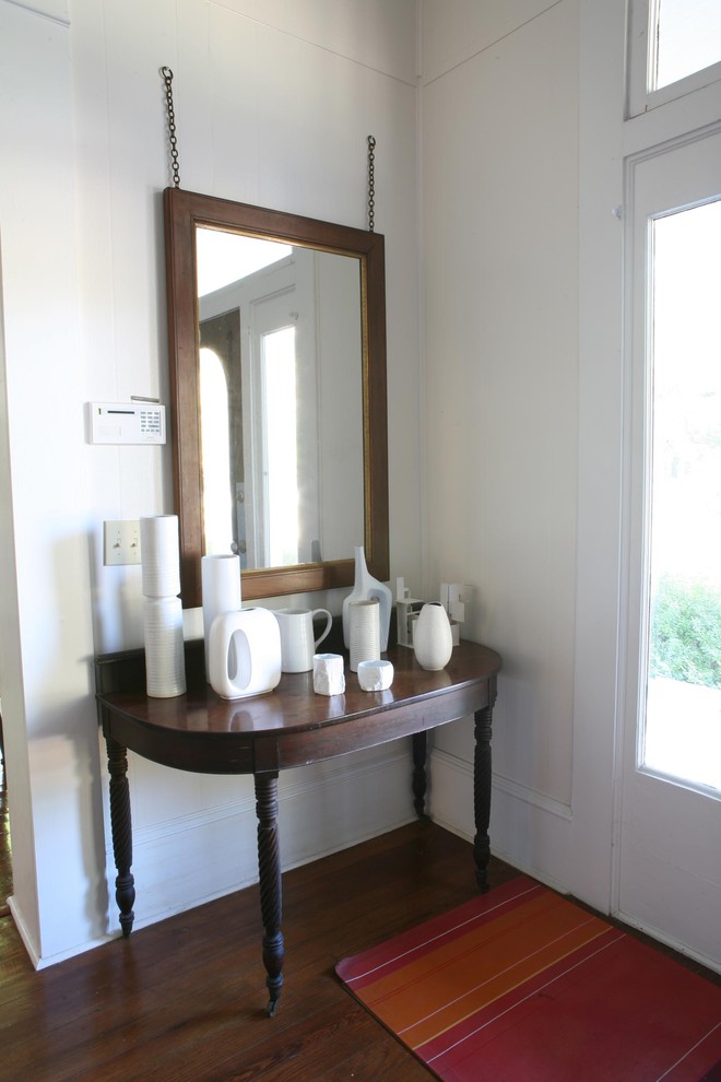 Inspiration for a contemporary entryway remodel in New York with white walls
