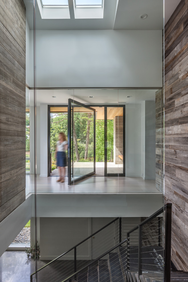 Inspiration for a mid-sized contemporary entryway remodel in Charleston with white walls and a black front door