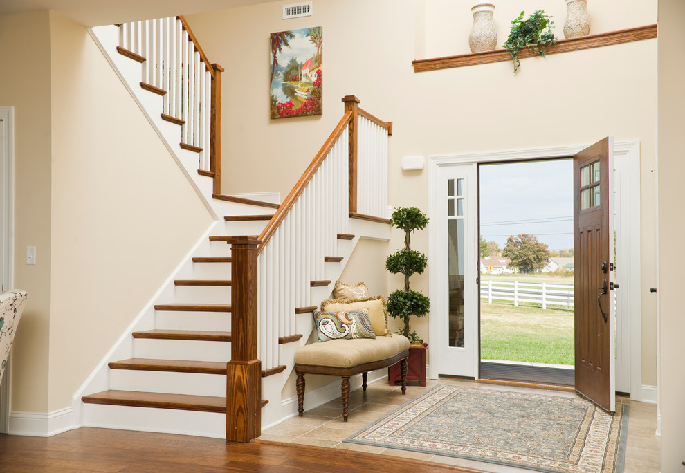 Entryway - mid-sized craftsman ceramic tile and beige floor entryway idea in Other with beige walls and a white front door