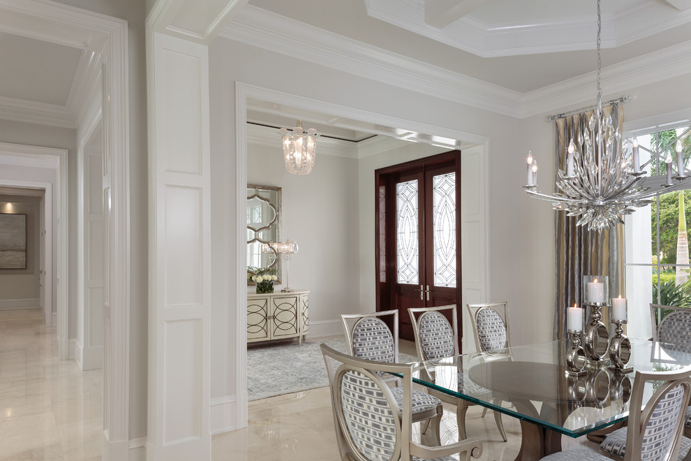Large beach style marble floor and white floor dining room photo in Miami with gray walls