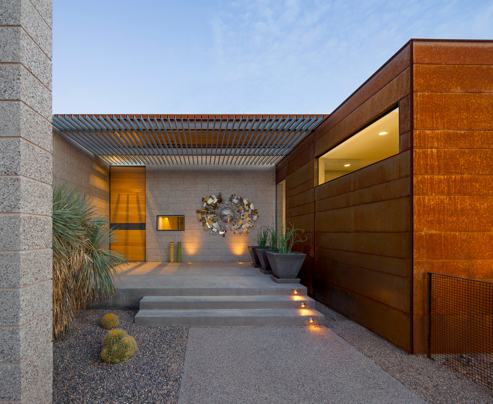 Minimalist entryway photo in Phoenix with a light wood front door