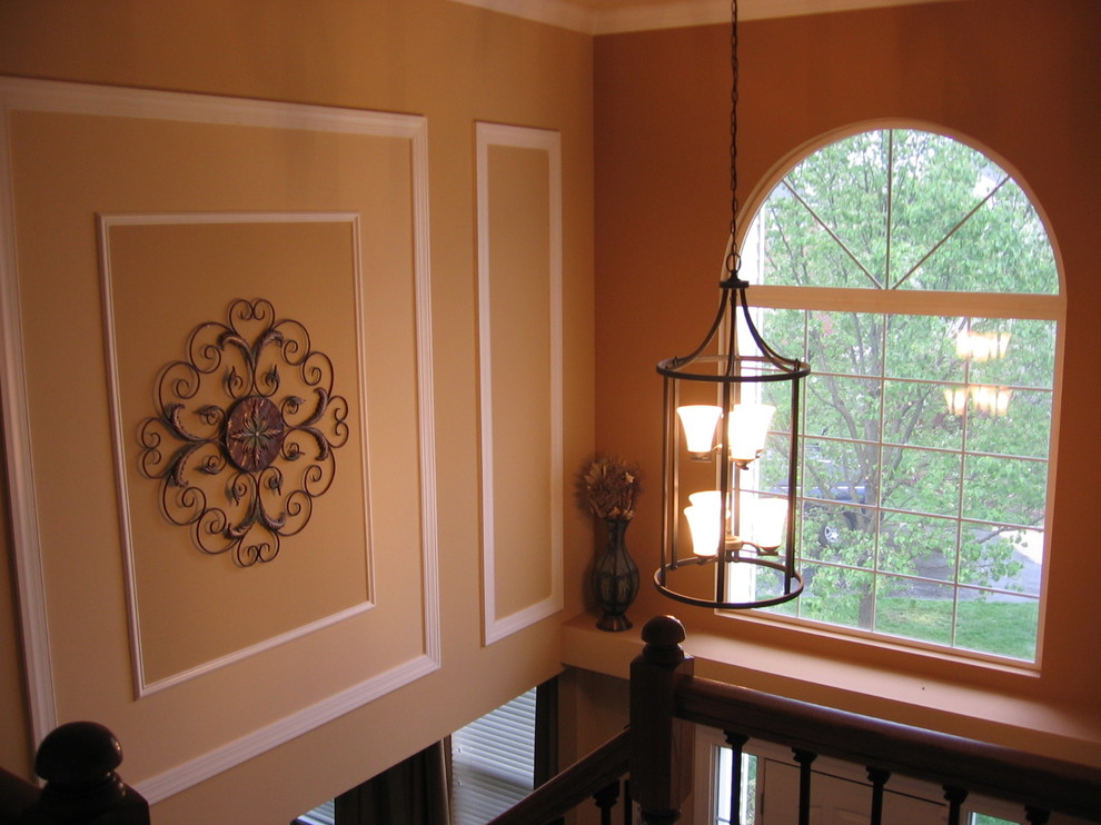Design ideas for a medium sized traditional foyer in DC Metro with beige walls.