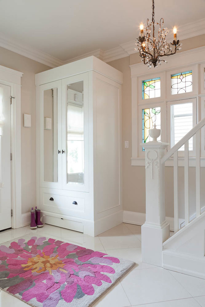 Example of a transitional front door design in Toronto with beige walls