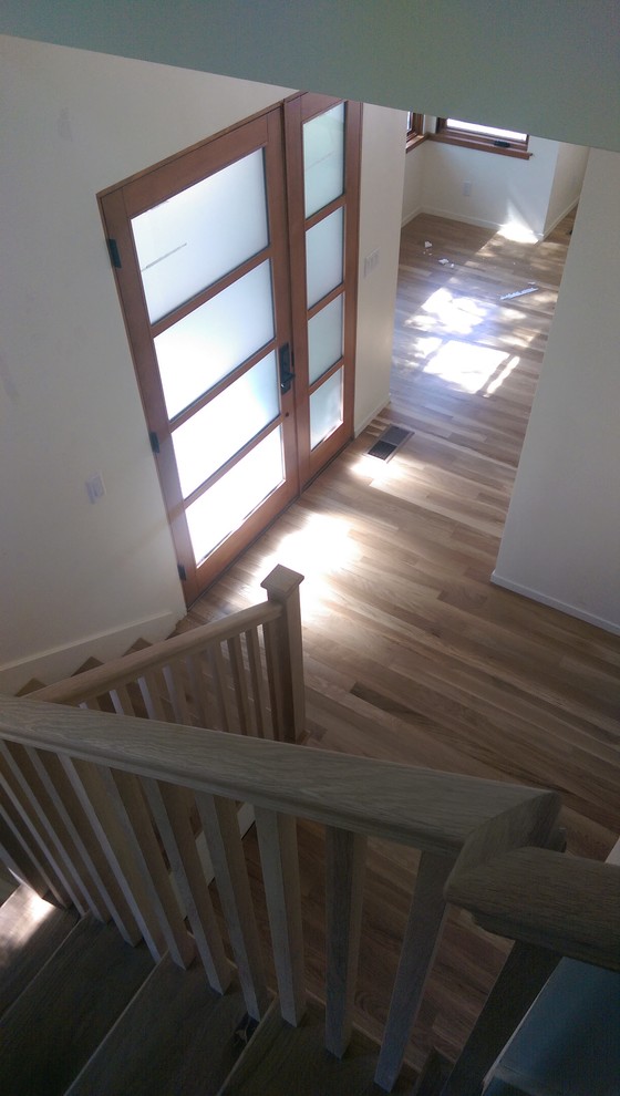 Example of a small minimalist light wood floor entryway design in San Francisco