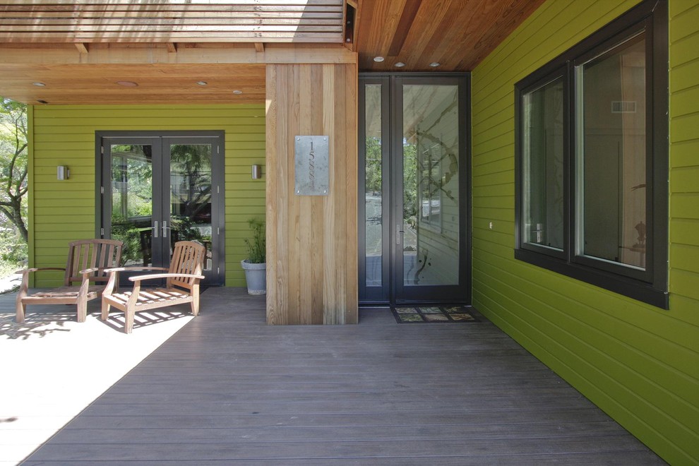 Example of a trendy entryway design in San Francisco with a glass front door and green walls