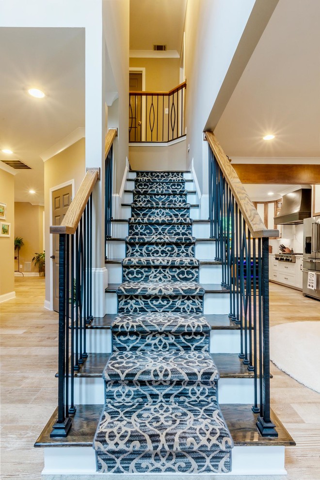 This is an example of a large midcentury staircase in Other.