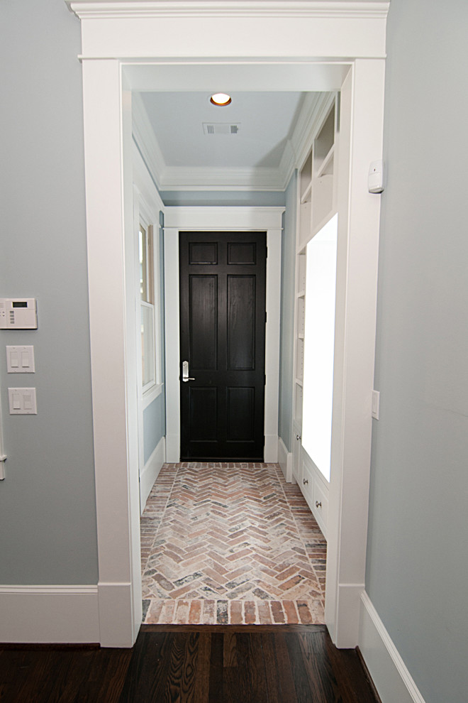 Inspiration for a craftsman brick floor entryway remodel in Houston