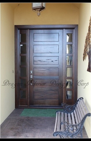 Large minimalist entryway photo in Vancouver with a dark wood front door
