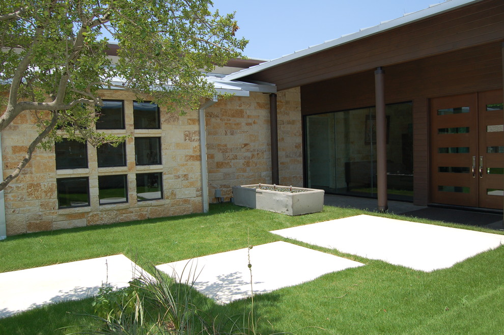Contemporary entrance in Dallas with a double front door and a dark wood front door.
