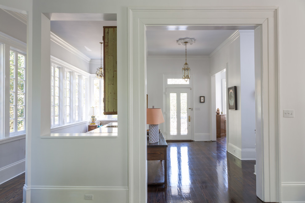 Inspiration for a large eclectic foyer in New Orleans with white walls, medium hardwood flooring, a single front door and a white front door.