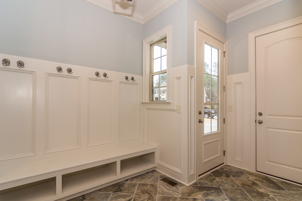 Example of a mid-sized minimalist porcelain tile entryway design in Raleigh with blue walls and a white front door