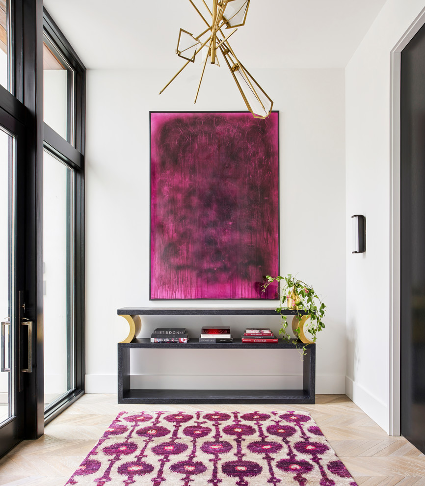 Inspiration for a contemporary light wood floor and beige floor single front door remodel in Chicago with white walls and a glass front door
