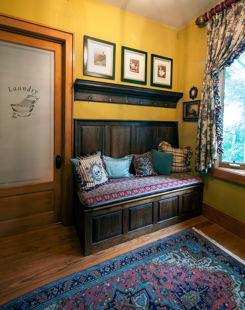 Inspiration for a timeless entryway remodel in Atlanta with yellow walls