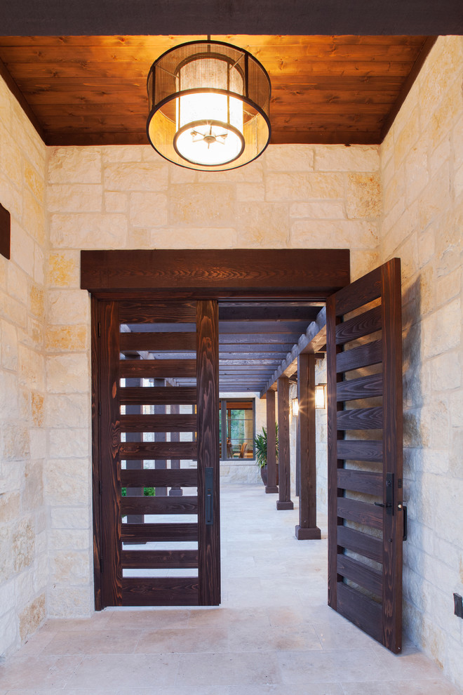 Inspiration for a rustic entryway remodel in Austin