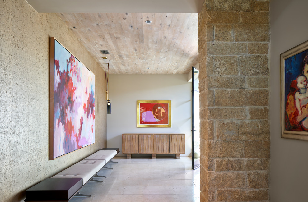 This is an example of a rural entrance in Austin with grey walls, beige floors and a wood ceiling.