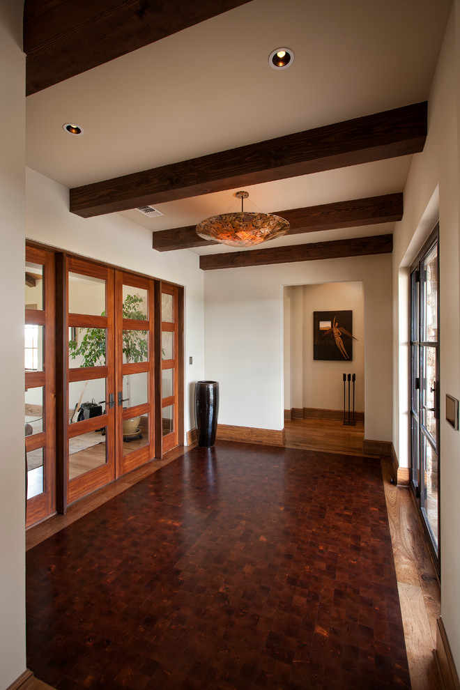 Large arts and crafts medium tone wood floor entryway photo in Austin with white walls and a medium wood front door