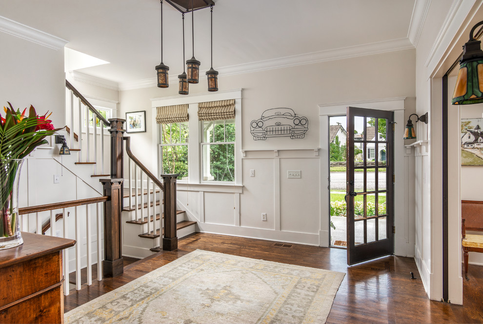 Inspiration for a medium sized classic foyer in Nashville with a single front door, beige walls, dark hardwood flooring, a glass front door and brown floors.