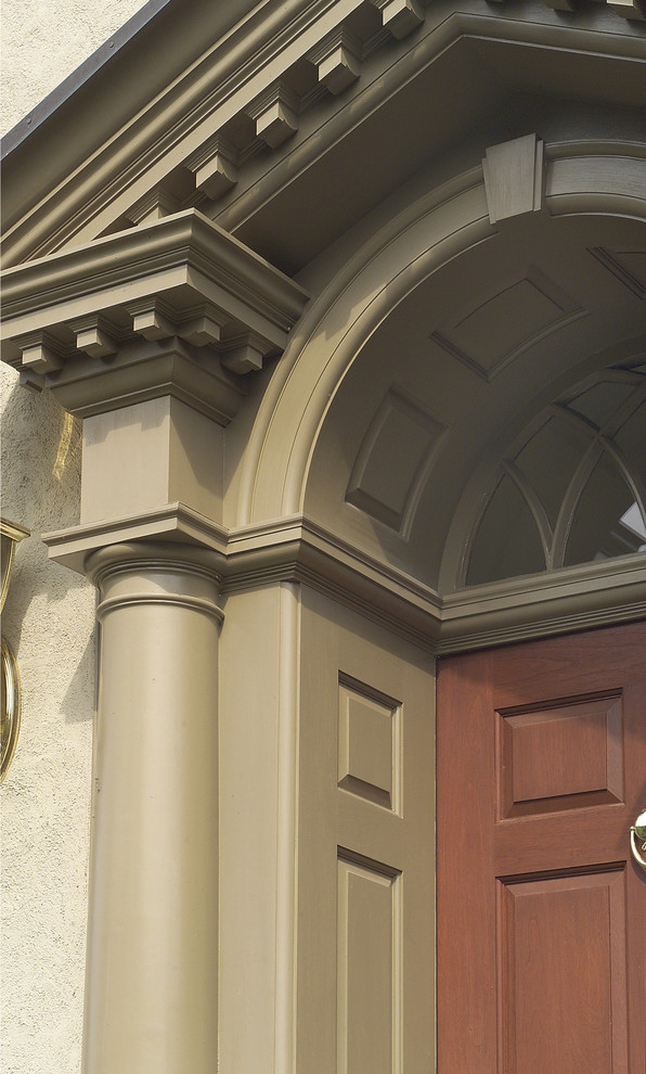 Elegant single front door photo in Philadelphia with beige walls and a light wood front door