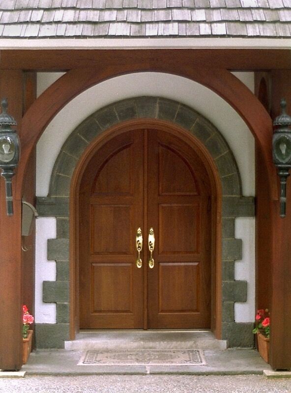 Elegant double front door photo in Philadelphia with beige walls and a light wood front door