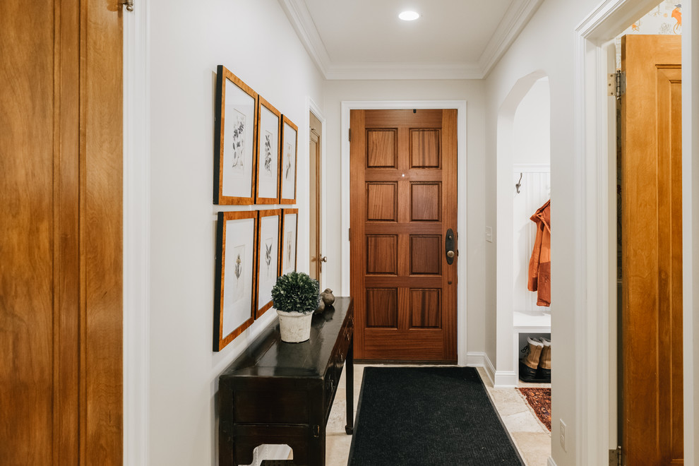 Large elegant light wood floor entryway photo in Minneapolis with white walls and a dark wood front door