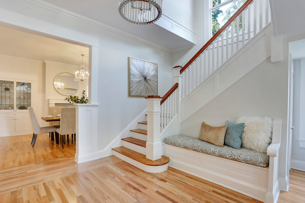 Large classic foyer in Tampa with white walls, light hardwood flooring, a single front door and a yellow front door.
