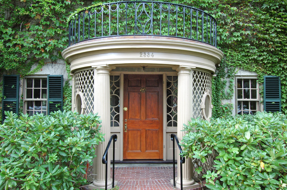 This is an example of a classic front door in Portland Maine with a single front door and a dark wood front door.