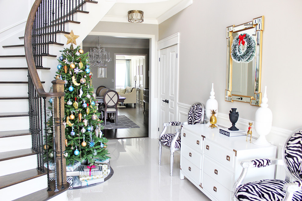 Example of a transitional white floor foyer design in Toronto with gray walls