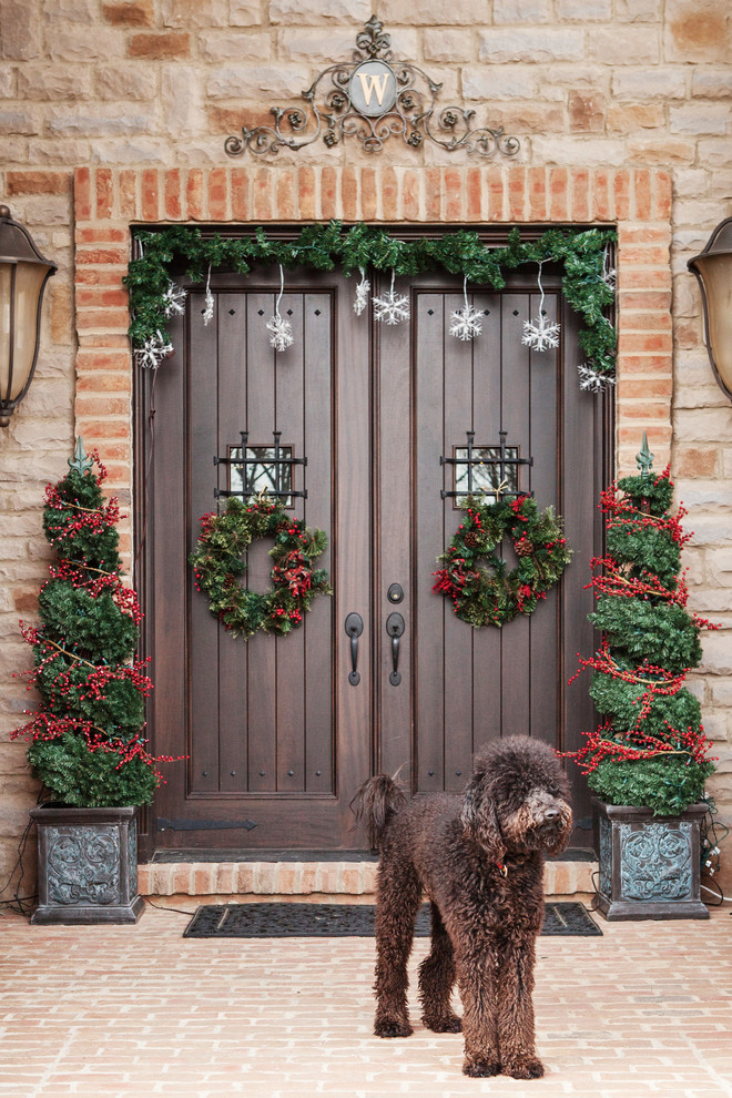 Inspiration for a timeless entryway remodel in Columbus with a dark wood front door