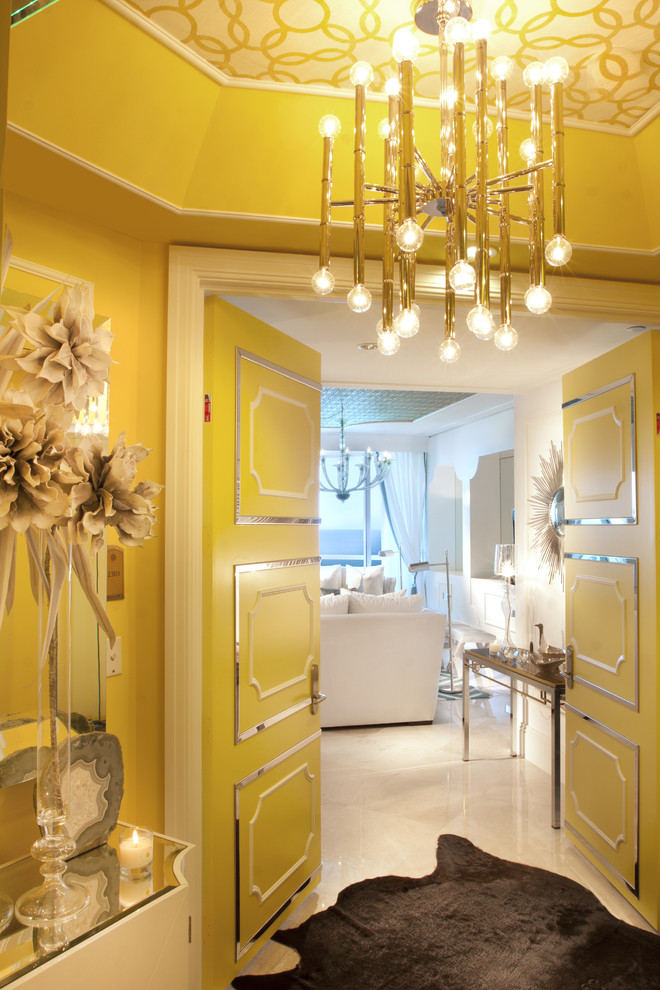 Inspiration for an eclectic white floor entryway remodel in Miami with yellow walls