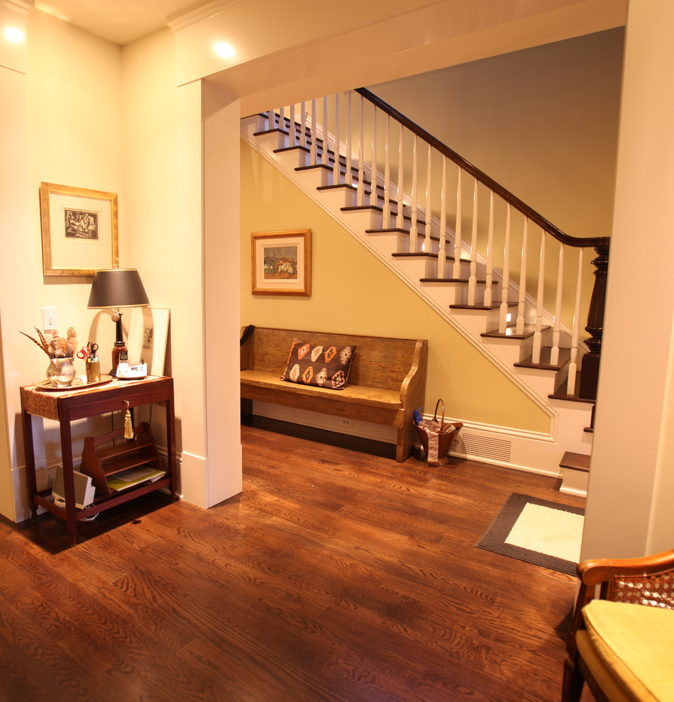 Mid-sized arts and crafts medium tone wood floor entry hall photo in Other with beige walls