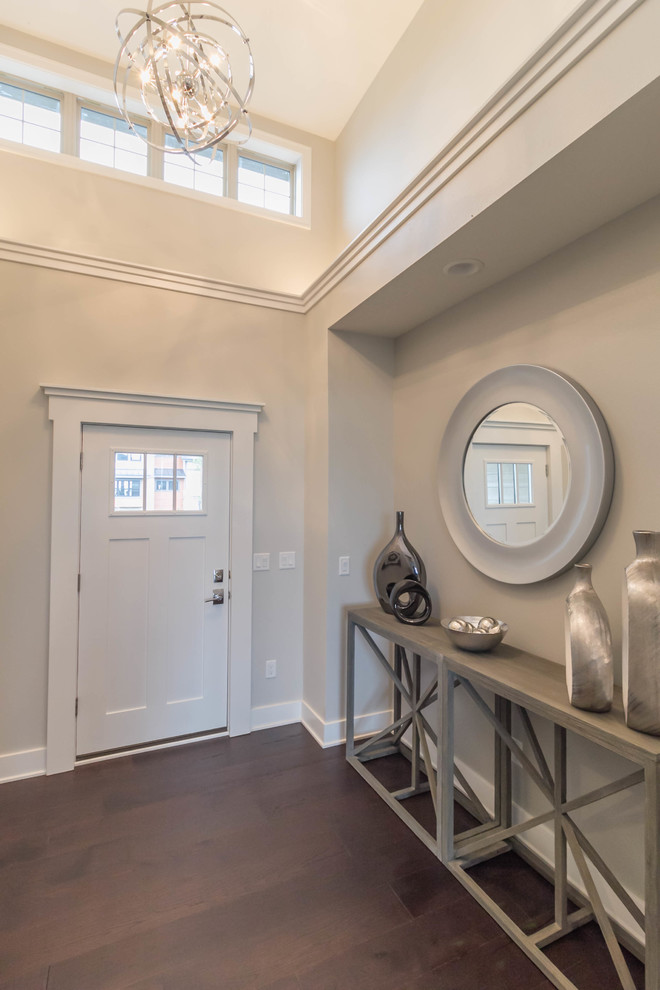 This is an example of a medium sized contemporary boot room in Other with grey walls, porcelain flooring, a single front door and a white front door.