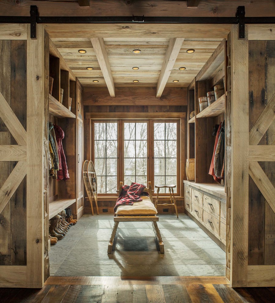 Inspiration for a rustic boot room in Burlington with brown walls and grey floors.