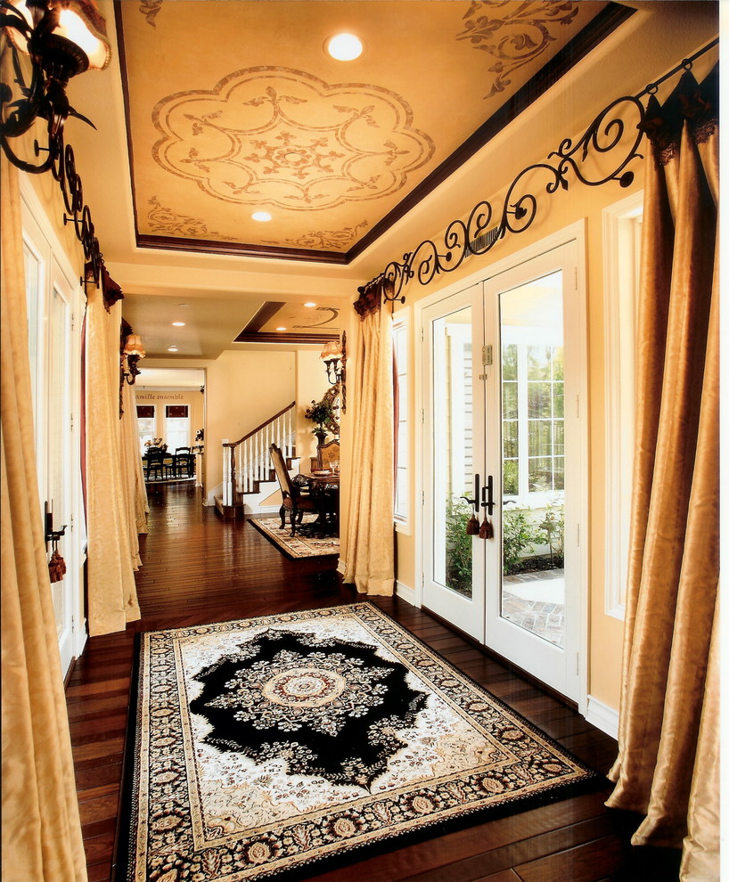 Traditional entrance in Orange County with dark hardwood flooring.