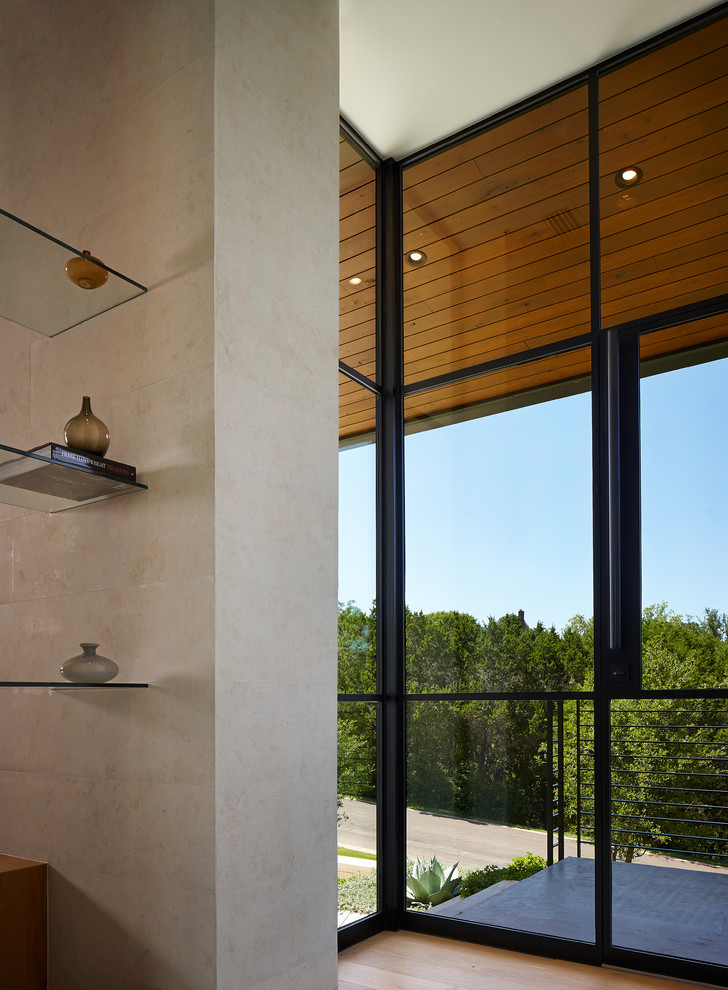 Entryway - contemporary entryway idea in Austin with a glass front door