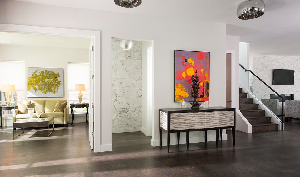 Design ideas for a classic entrance in Dallas with white walls, dark hardwood flooring and feature lighting.