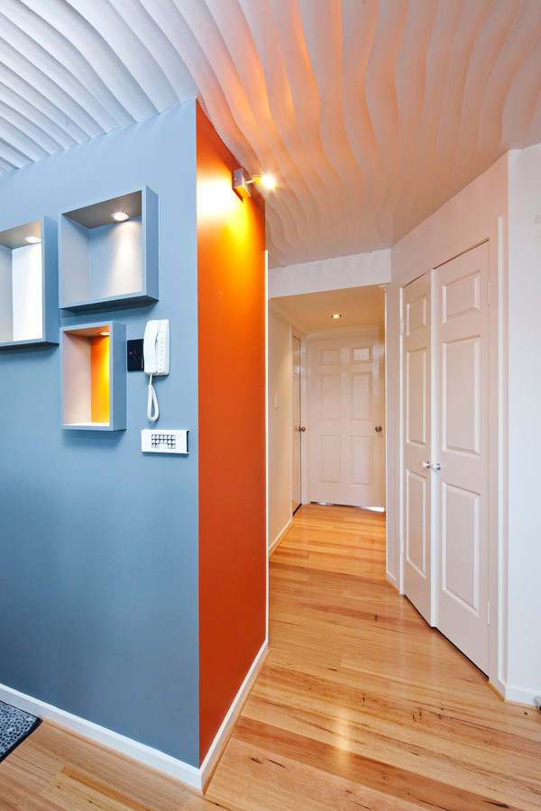 Design ideas for a small contemporary hallway in Gold Coast - Tweed with medium hardwood flooring.