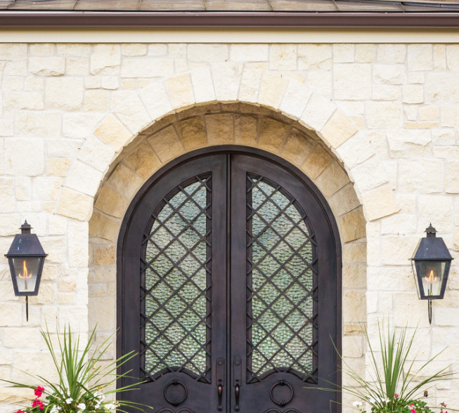 Mid-sized tuscan entryway photo in Nashville with a glass front door