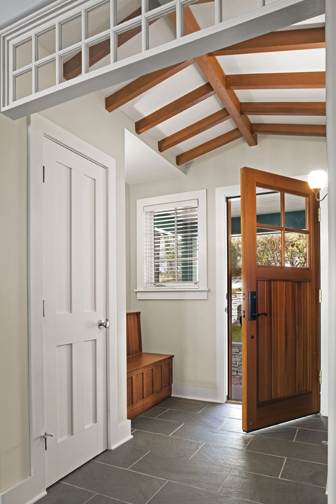 Single front door - transitional slate floor single front door idea in Bridgeport with a medium wood front door