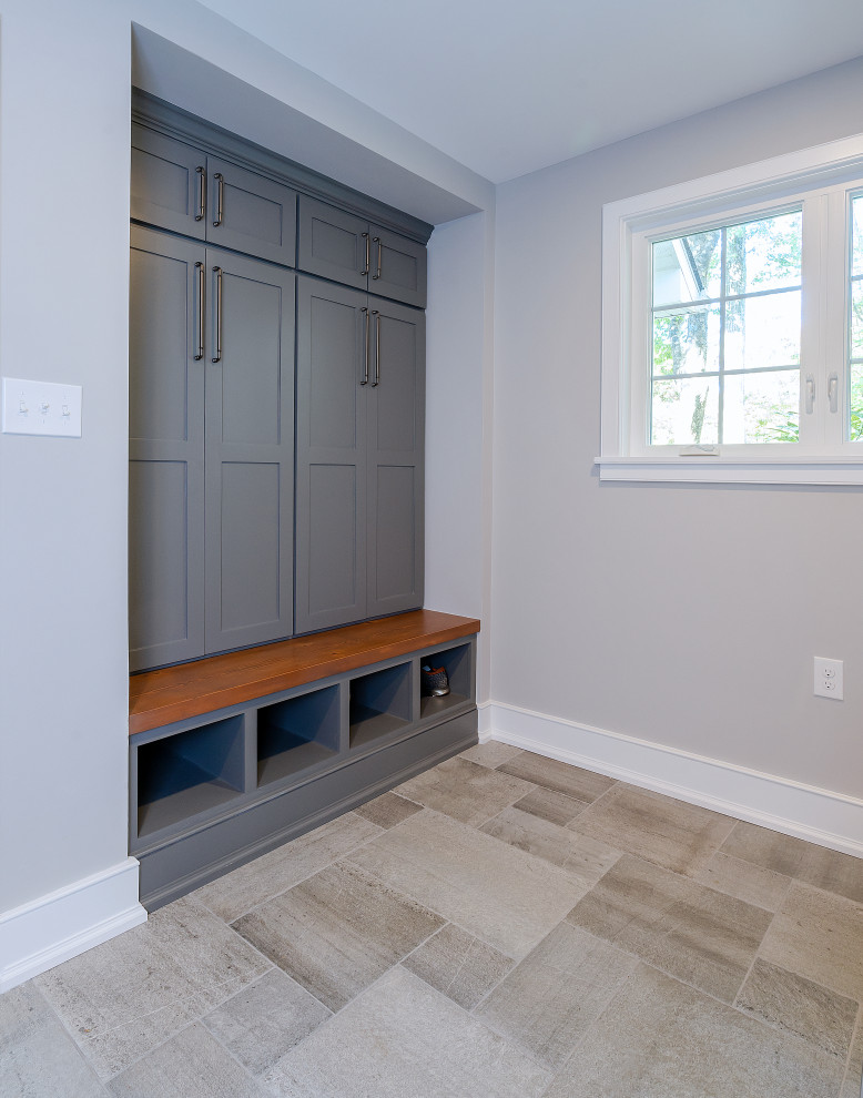 Medium sized rural boot room in Philadelphia with grey walls and porcelain flooring.